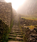 Andean stone steps leading upwards into the mist.